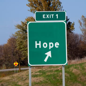 highway sign saying Hope exit 1